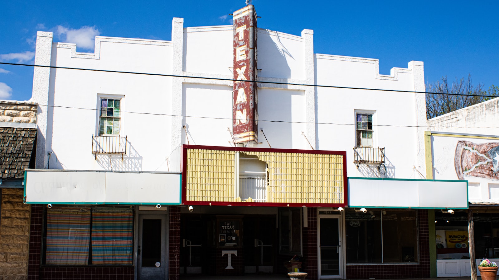 The marquee of a historic small-town theater on a Texas Main Street