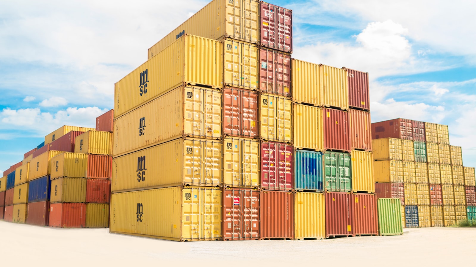 Stacked intermodal shipping containers at a freight yard