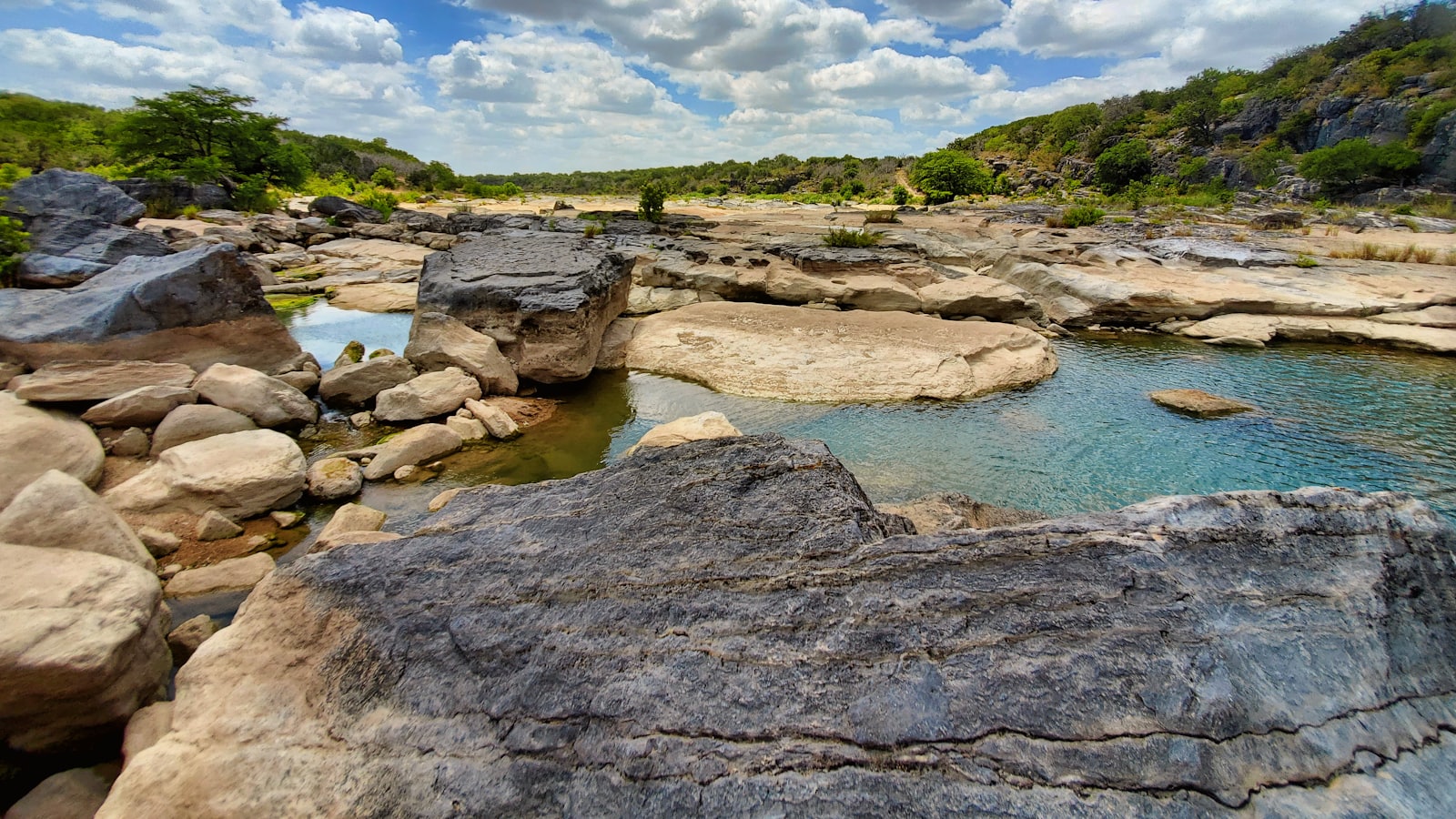 A rocky river winding through the Texas Hill Country